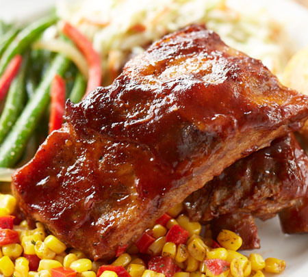 Ribs with a side of corn and beans.