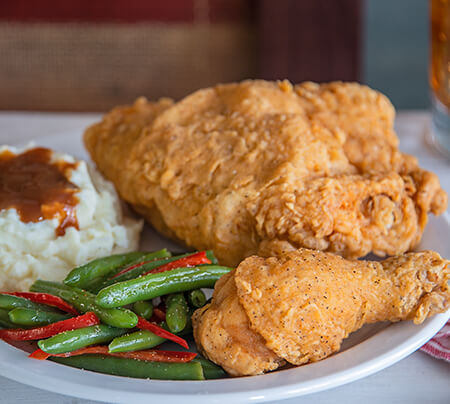 Southern Fried Chicken served with mash potatoes and gravy and green beans