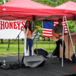 Performer singing at the festival after the 5k run.