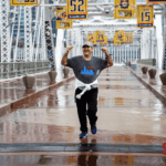 David Davoudpour finishing the 5k run in the rain on the bridge.